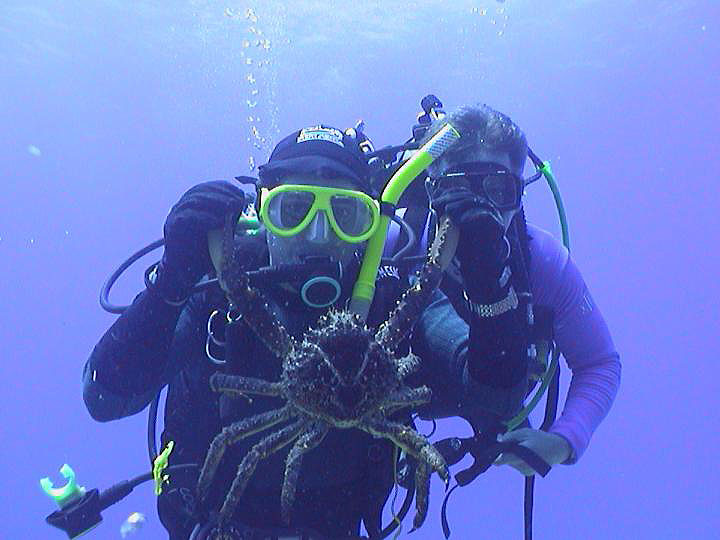 Scuba Divers with crab - photo by Pepe Scuba - Maya Expeditions
