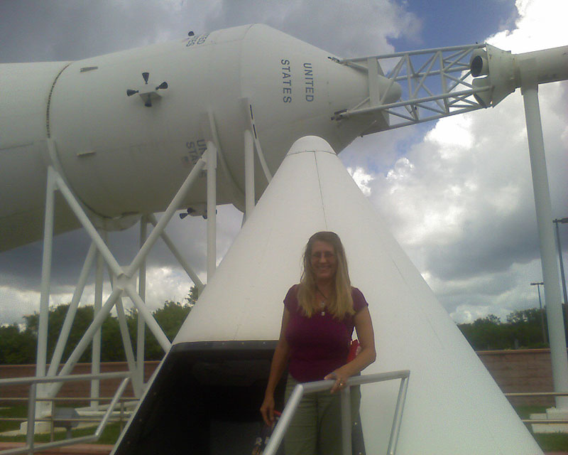 Tammy by command module in Rocket Garden - Kennedy Space Center NASA
